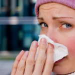 young female having a cold