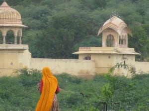 A woman walks by a temple in Rajasthan. 
