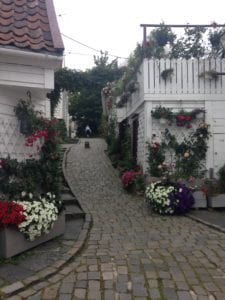 Amble around town and you might stumble across cute local spots like this alley in old town, Stavanger in Norway. 